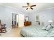 Bedroom showcasing light blue walls, a ceiling fan, a dresser with mirror, and doors leading to other rooms at 3 Bent Oak Ct, Durham, NC 27705
