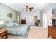 Bedroom with a plush bed, matching nightstands, a dresser, and an exterior exit door at 3 Bent Oak Ct, Durham, NC 27705