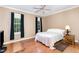 Bedroom showcasing hardwood floors, natural light, and neutral paint, creating a cozy ambiance at 3 Bent Oak Ct, Durham, NC 27705