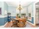Cozy dining area with chandelier lighting and views to the backyard at 3 Bent Oak Ct, Durham, NC 27705