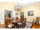 Elegant dining room adjacent to kitchen with views to living area at 3 Bent Oak Ct, Durham, NC 27705