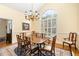 Elegant dining room featuring large window and chandelier at 3 Bent Oak Ct, Durham, NC 27705