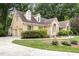 Charming brick home with well-manicured lawn, circular driveway, and attached garage offering convenience at 3 Bent Oak Ct, Durham, NC 27705