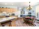 Bright kitchen with granite countertops, stainless appliances, and dining area at 3 Bent Oak Ct, Durham, NC 27705