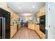 Spacious kitchen featuring tile floors, light cabinets, and stainless-steel appliances at 3 Bent Oak Ct, Durham, NC 27705