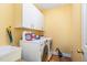 Laundry room featuring a washer, dryer, overhead cabinets, and a utility sink at 3 Bent Oak Ct, Durham, NC 27705