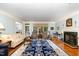 Bright and airy living room boasting hardwood floors, fireplace, and large windows at 3 Bent Oak Ct, Durham, NC 27705