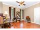 Office space with hardwood floors, natural light from two windows, and neutral wall colors at 3 Bent Oak Ct, Durham, NC 27705