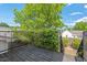 View of the back deck featuring an ivy wall, trees and a nearby house at 309 S Haywood St St, Raleigh, NC 27601
