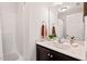 Bright bathroom featuring a shower/tub combination and a granite-topped vanity with decorative accents at 309 S Haywood St St, Raleigh, NC 27601