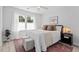 Bright bedroom with large window, ceiling fan, and elegant decor at 309 S Haywood St St, Raleigh, NC 27601
