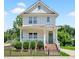 Charming two-story home featuring a welcoming front porch, well-manicured landscaping, and a classic architectural style at 309 S Haywood St St, Raleigh, NC 27601