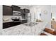 Kitchen with granite countertop, stainless steel appliances, and dark wood cabinets at 309 S Haywood St St, Raleigh, NC 27601