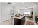 Open kitchen/living area with island and granite countertops at 309 S Haywood St St, Raleigh, NC 27601