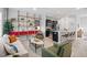Open-concept living area with stylish decor, stainless steel appliances, and breakfast bar at 309 S Haywood St St, Raleigh, NC 27601