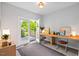 Inviting office space with built-in desks and double doors opening to the outdoors at 309 S Haywood St St, Raleigh, NC 27601
