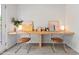 Bright office space with built-in wooden desk, sleek chairs, and modern decor at 309 S Haywood St St, Raleigh, NC 27601