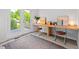 Well-lit office area featuring a built-in desk and access to a private outdoor space at 309 S Haywood St St, Raleigh, NC 27601