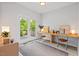 Bright office space with modern decor, built-in desk, and access to outdoor deck at 309 S Haywood St St, Raleigh, NC 27601