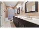 Bathroom features a large vanity with dual sinks, stylish mirrors, and a tub-shower combo at 31 River View Ct, Timberlake, NC 27583