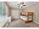 Cozy bedroom with a wooden bunk bed, neutral walls, and a window to allow for plenty of natural light at 31 River View Ct, Timberlake, NC 27583