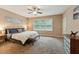 Serene bedroom features soft carpeting, a window that provides natural light, and a cozy bench at 31 River View Ct, Timberlake, NC 27583