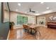 Inviting dining room featuring a wooden table, stylish chairs, and large window providing ample natural light at 31 River View Ct, Timberlake, NC 27583