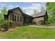 Beautifully maintained home with lush lawn and mature landscaping for enhanced curb appeal at 31 River View Ct, Timberlake, NC 27583