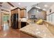 Well-appointed kitchen with granite countertops, custom cabinetry, and stainless steel appliances at 31 River View Ct, Timberlake, NC 27583