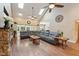 Expansive living room featuring a cozy seating area, skylights, and elegant décor at 31 River View Ct, Timberlake, NC 27583
