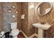 Unique powder room featuring a pedestal sink, round mirror, and eye-catching zebra-striped wallpaper at 31 River View Ct, Timberlake, NC 27583