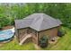 Aerial view of the back of the house featuring a deck and swimming pool at 31 River View Ct, Timberlake, NC 27583