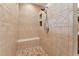 Spacious tiled walk-in shower featuring a built-in bench, and decorative accents for a luxurious bathing experience at 31 River View Ct, Timberlake, NC 27583
