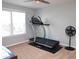 Bedroom with carpet featuring exercise equipment, a ceiling fan, and natural light at 312 Crusaders Dr, Morrisville, NC 27560