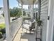Charming covered front porch with rocking chairs and a potted plant at 312 Crusaders Dr, Morrisville, NC 27560