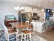 Stylish kitchen featuring white cabinets, granite countertops, stainless steel appliances, and an island with seating at 312 Crusaders Dr, Morrisville, NC 27560