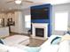 Comfortable living room featuring a fireplace, modern decor, and an open layout connecting to the kitchen at 312 Crusaders Dr, Morrisville, NC 27560