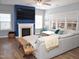 Cozy living room with a fireplace, a large sectional sofa, hardwood floors, and plenty of natural light at 312 Crusaders Dr, Morrisville, NC 27560
