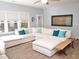 Spacious living room with a large sectional sofa, hardwood floors, ample natural light, and stylish decor at 312 Crusaders Dr, Morrisville, NC 27560