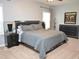 Comfortable main bedroom with a king-size bed, modern furniture, neutral decor, and plenty of natural light at 312 Crusaders Dr, Morrisville, NC 27560