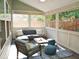 Screened-in porch featuring comfortable seating, a ceiling fan and natural light at 312 Crusaders Dr, Morrisville, NC 27560