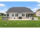 Spacious backyard featuring a patio, outdoor seating, a grill and a hot tub at 337 Brinkley Cir, Mebane, NC 27302