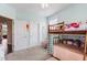 bedroom featuring a bunkbed, large windows, carpet, and blue accent walls at 337 Brinkley Cir, Mebane, NC 27302