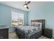 Comfortable bedroom features ceiling fan, natural light, and neutral colored walls and carpet at 337 Brinkley Cir, Mebane, NC 27302