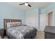 Cozy bedroom features a ceiling fan, neutral carpet and modern blue accent wall at 337 Brinkley Cir, Mebane, NC 27302