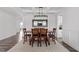 Open concept dining room with decorative rug and views of the living space at 337 Brinkley Cir, Mebane, NC 27302