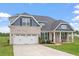 Charming single-Gathering home with a well-manicured lawn and attached two-car garage at 337 Brinkley Cir, Mebane, NC 27302