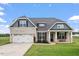 Charming single-Gathering home with a well-manicured lawn and attached two-car garage at 337 Brinkley Cir, Mebane, NC 27302