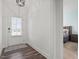 Hallway leading to a bedroom with a view of the doorway and wood flooring at 337 Brinkley Cir, Mebane, NC 27302