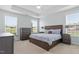 Spacious main bedroom featuring tray ceiling, generous natural light, and neutral decor at 337 Brinkley Cir, Mebane, NC 27302